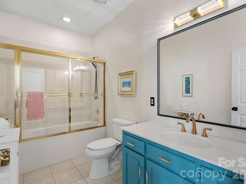 8049 Ravenwood Lane, Stanley, NC 28164.  MLS# CAR4426461, YatesRealty ID 54579. Downstairs hall bath