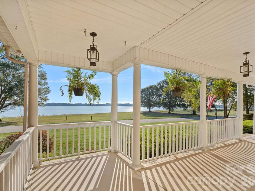 8049 Ravenwood Lane, Stanley, NC 28164.  MLS# CAR4426461, YatesRealty ID 54579. Front coverred patio