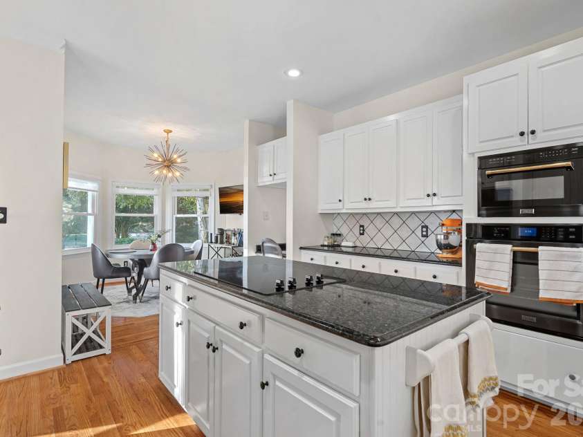 8049 Ravenwood Lane, Stanley, NC 28164.  MLS# CAR4426461, YatesRealty ID 54579. Kitchen with island