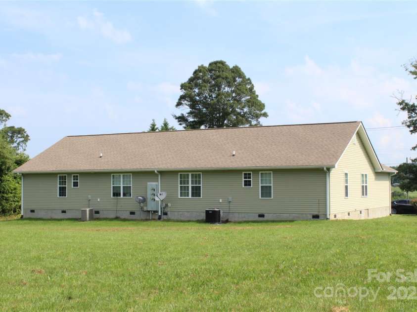 544 Tracy Grove Road, Flat Rock, NC 28731.  MLS# CAR4275855, YatesRealty ID 5459. 544 Tracy Grove Rd. Duplex backyard