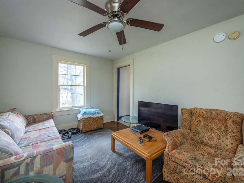 76 Oakwood Street, Asheville, NC 28806.  MLS# CAR4239865, YatesRealty ID 5459. Apartment living room