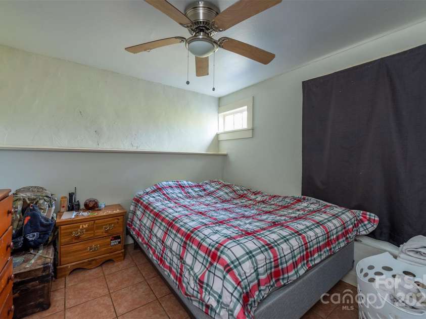 76 Oakwood Street, Asheville, NC 28806.  MLS# CAR4239865, YatesRealty ID 5459. Apartment living room