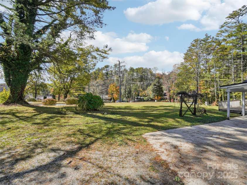 34 Parkview Drive, Brevard, NC 28712.  MLS# CAR4316145, YatesRealty ID 546. Side yard