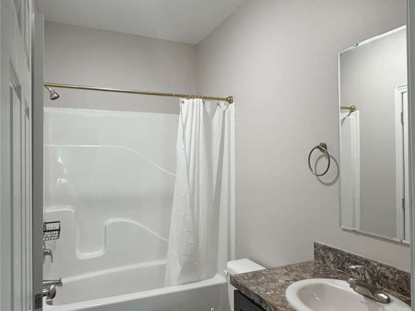 323 Martin Street, Shelby, NC 28150.  MLS# CAR4429863, YatesRealty ID 54603. Common bathroom located between the secondary bedrooms