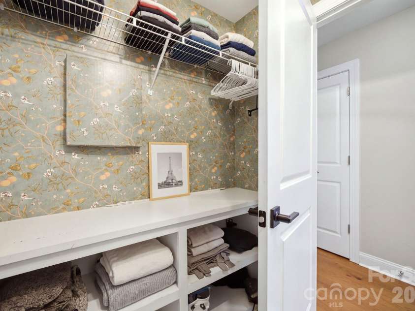 612 Highland Ridge Point, Clover, SC 29710.  MLS# CAR4424384, YatesRealty ID 54612. 2nd floor laundry with built in storage and shelving