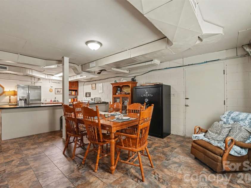 211 21st Street, Kannapolis, NC 28081.  MLS# CAR4430291, YatesRealty ID 54629. Dining area in the basement