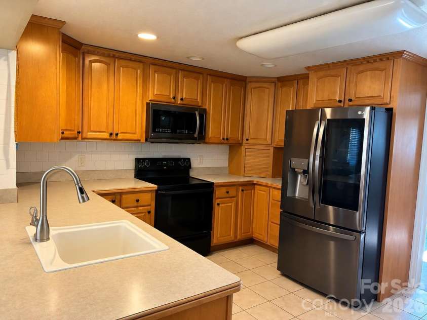 203 Regan Street, East Flat Rock, NC 28726.  MLS# CAR4430392, YatesRealty ID 54630. Kitchen