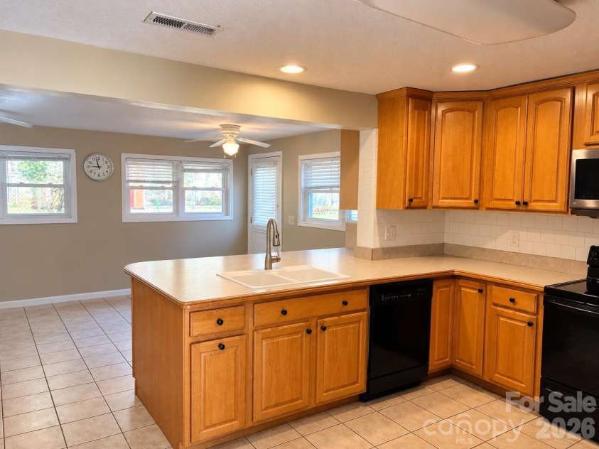 203 Regan Street, East Flat Rock, NC 28726.  MLS# CAR4430392, YatesRealty ID 54630. Open Kitchen area.