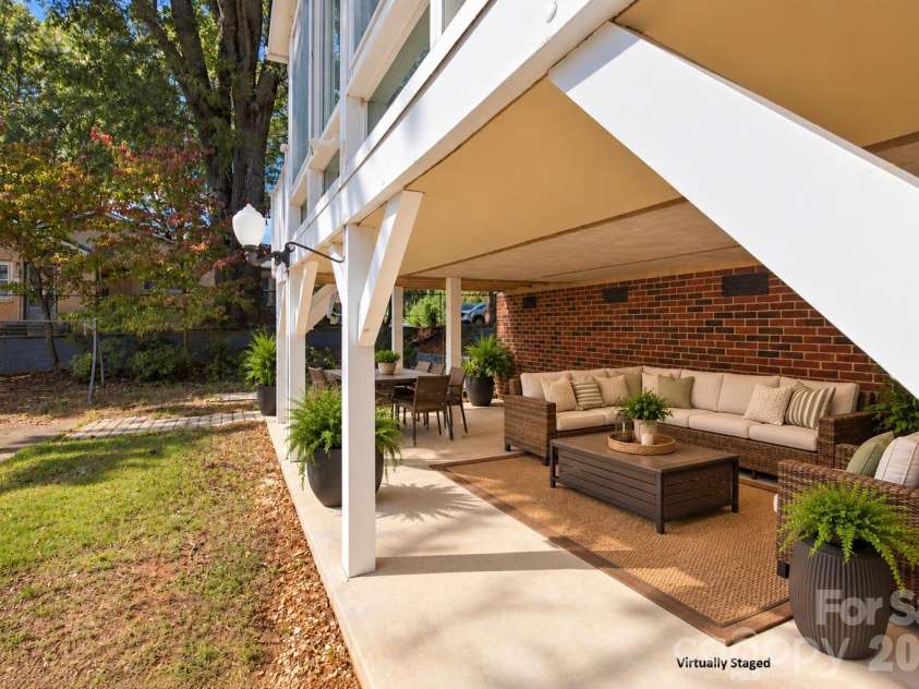 217 23rd Street, Hickory, NC 28601.  MLS# CAR4430349, YatesRealty ID 54634. Virtually staged patio area under sunroom