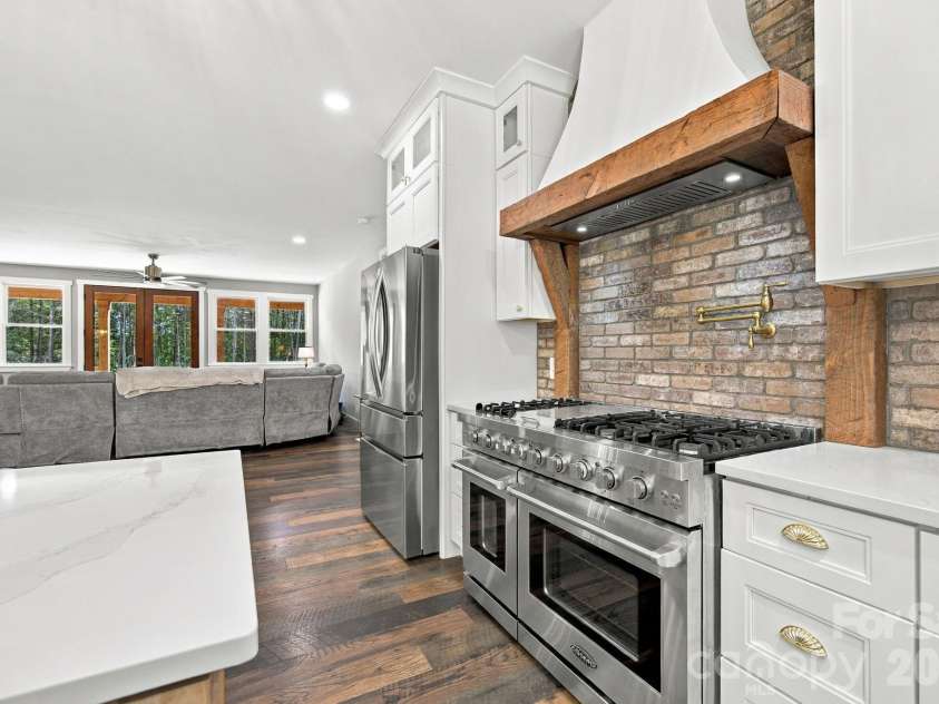 1020 Rock Pond Lane, Salisbury, NC 28146.  MLS# CAR4430684, YatesRealty ID 54636. Convenient pot filler with brick backsplash
