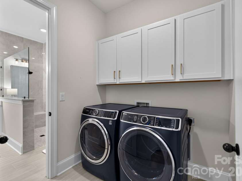 1018 Lowland Way, Waxhaw, NC 28173.  MLS# CAR4427578, YatesRealty ID 54654. Laundry Room with Primary Bathroom Entry