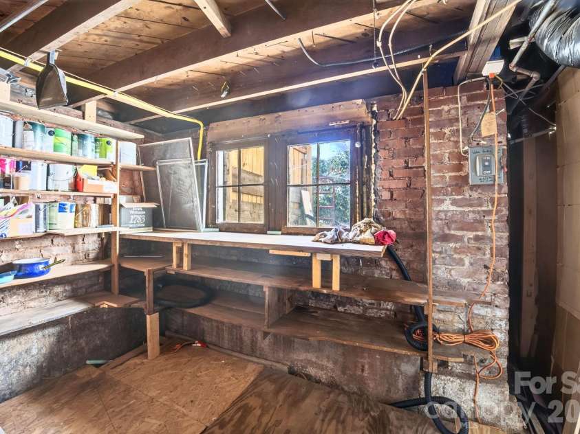 201 Logan Avenue, Asheville, NC 28806.  MLS# CAR4426540, YatesRealty ID 54658. Sump Pump Under Temporary Floor