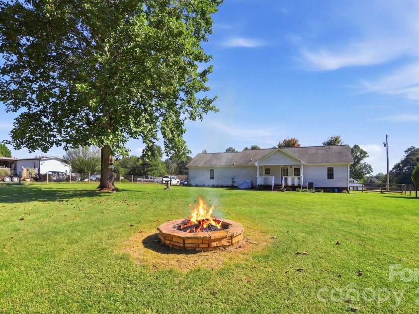 2455 Fay Jones Road, Denver, NC 28037.  MLS# CAR4429616, YatesRealty ID 54661. Fire in fire pit was virtually placed