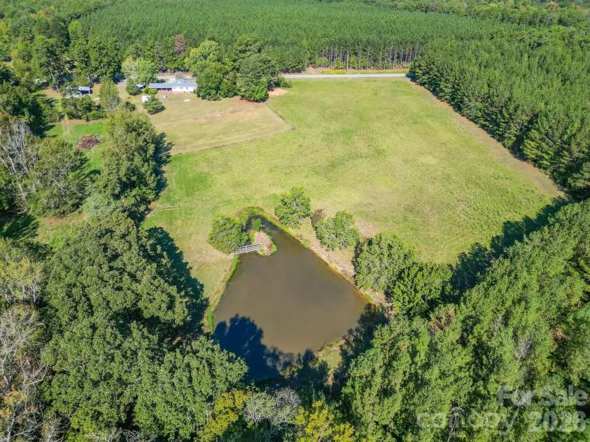 7615 Rocky River Road, Union, NC 28112.  MLS# CAR4430607, YatesRealty ID 54670. Beautiful open pasture with large pond