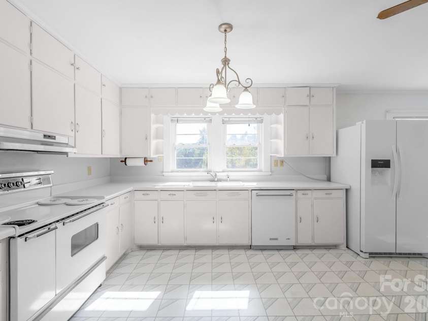 7615 Rocky River Road, Union, NC 28112.  MLS# CAR4430607, YatesRealty ID 54670. Charming kitchen with original cabinetry