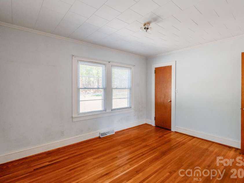 7615 Rocky River Road, Union, NC 28112.  MLS# CAR4430607, YatesRealty ID 54670. Front bedroom with original hardwoods