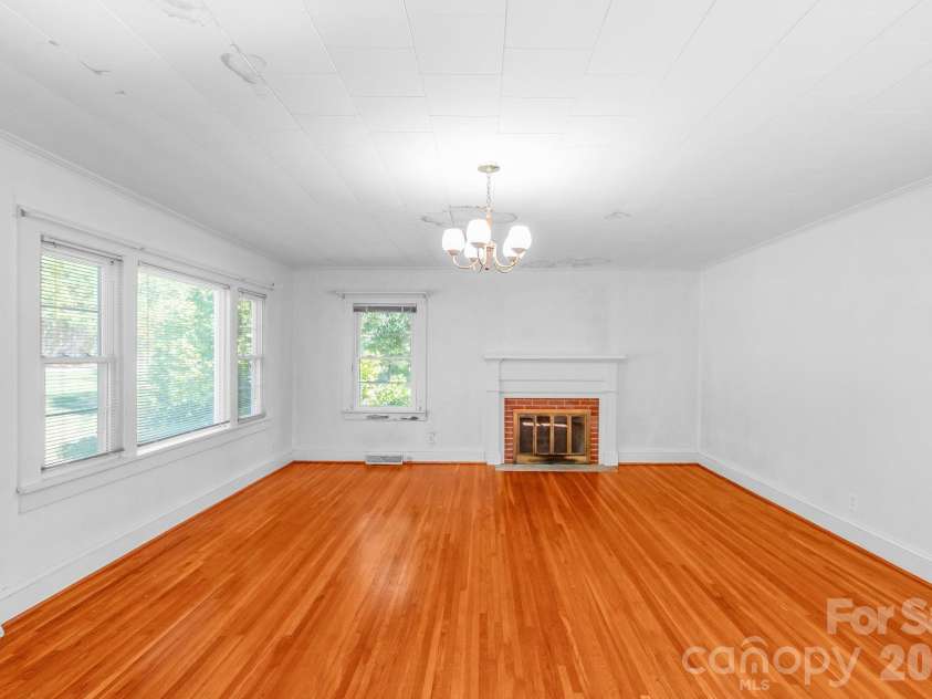 7615 Rocky River Road, Union, NC 28112.  MLS# CAR4430607, YatesRealty ID 54670. Living Room with Fireplace