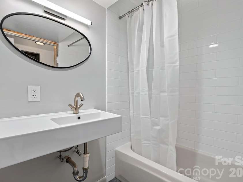 53 Hemlock Street, Arden, NC 28704.  MLS# CAR4430956, YatesRealty ID 54671. Downstairs bathroom