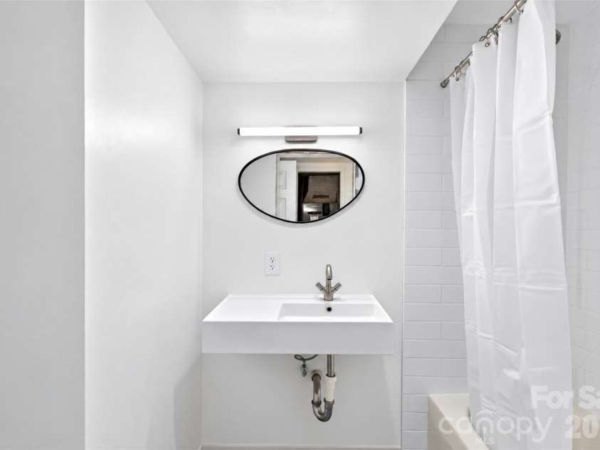 53 Hemlock Street, Arden, NC 28704.  MLS# CAR4430956, YatesRealty ID 54671. Downstairs bathroom