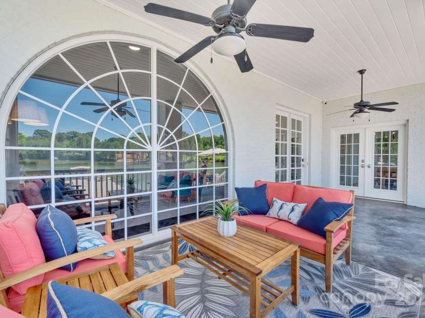 8150 Malibu Pointe Lane, Denver, NC 28037.  MLS# CAR4234717, YatesRealty ID 5468. Downstairs covered balcony overlooking the lake right off of breakfast nook & living room/kitchen.