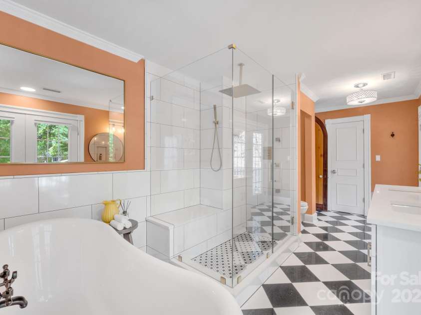 8150 Malibu Pointe Lane, Denver, NC 28037.  MLS# CAR4234717, YatesRealty ID 5468. Primary bathroom with custom shower including rain shower, wand, body sprays, bench and frameless glass