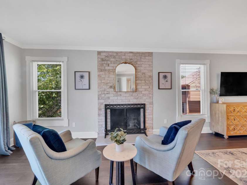 8150 Malibu Pointe Lane, Denver, NC 28037.  MLS# CAR4234717, YatesRealty ID 5468. Primary bedroom sitting area with fireplace and balcony with multiple lake views