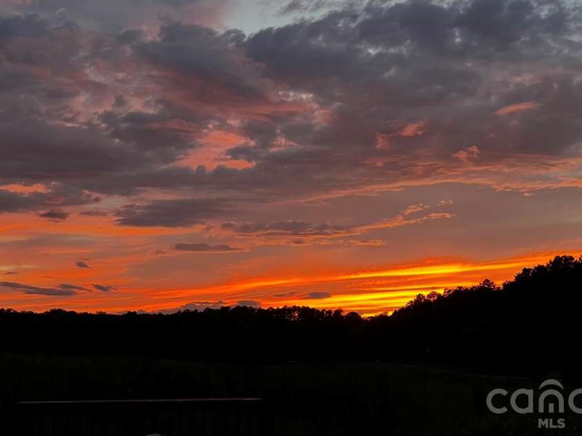 131 Burch Hutchins Road, Forest City, NC 28043.  MLS# CAR4430340, YatesRealty ID 54697. Sunset from deck