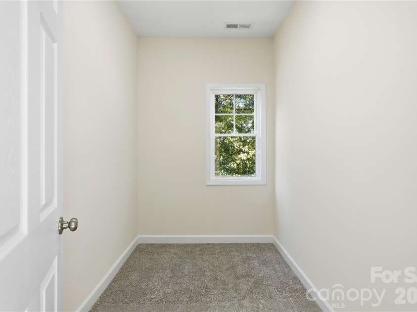 2881 Kiser Road, Winston Salem, NC 27106.  MLS# CAR4352028, YatesRealty ID 5473. Storage room off laundry