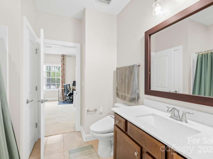 705 Brown Creek Drive, Matthews, NC 28104.  MLS# CAR4244288, YatesRealty ID 5473. Bath attached to Bedroom 2