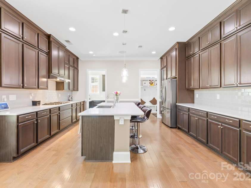 705 Brown Creek Drive, Matthews, NC 28104.  MLS# CAR4244288, YatesRealty ID 5473. Kitchen Main View with Channel Music (Ceiling)