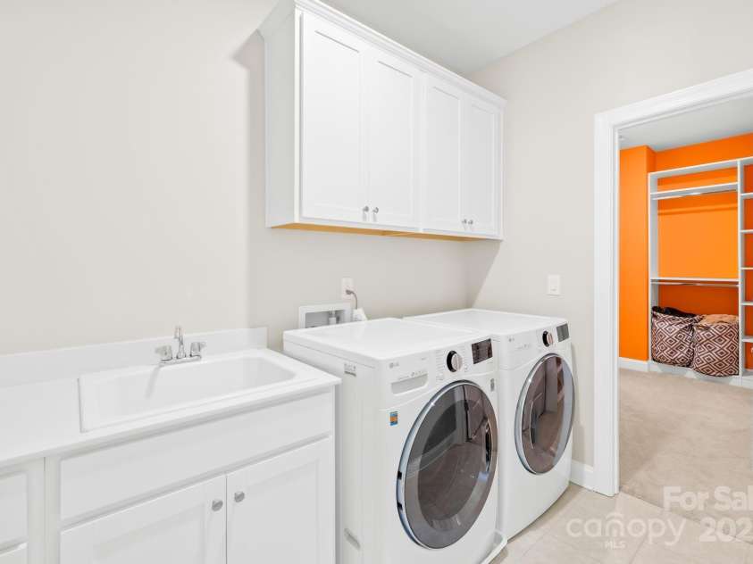 705 Brown Creek Drive, Matthews, NC 28104.  MLS# CAR4244288, YatesRealty ID 5473. Laundry with Custom Cabinetry