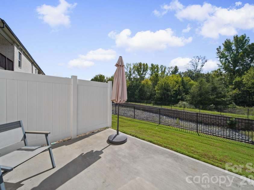 203 Heathbrook Lane, Waxhaw, NC 28173.  MLS# CAR4429780, YatesRealty ID 54740. Back patio