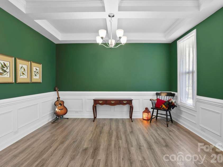 265 Fox Cove Road, Hendersonville, NC 28792.  MLS# CAR4356142, YatesRealty ID 5476. Formal dining room with wainscoting and a coffered ceiling