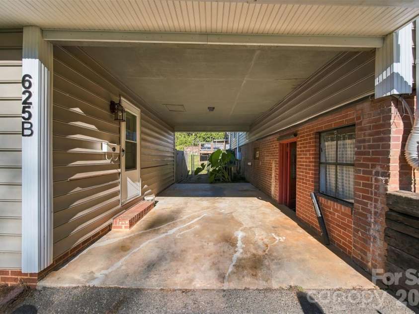625 Park Drive, Lincolnton, NC 28092.  MLS# CAR4430882, YatesRealty ID 54771. Covered patio area between basement walkout and apartment.