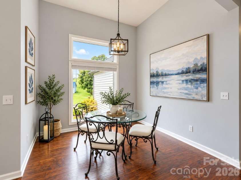 60 Golden Lane, Leicester, NC 28748.  MLS# CAR4429246, YatesRealty ID 54773. Dining VE with artwork
