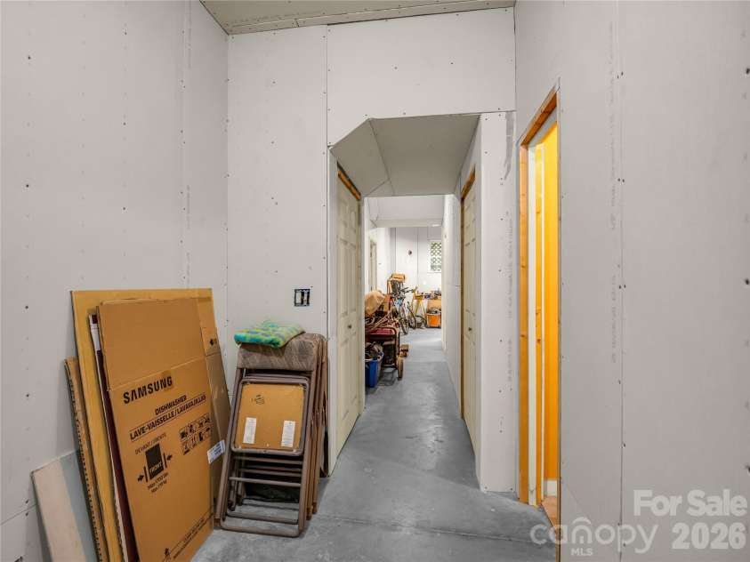 61 Mountain Shadows Drive, Leicester, NC 28748.  MLS# CAR4431319, YatesRealty ID 54790. Basement Hall