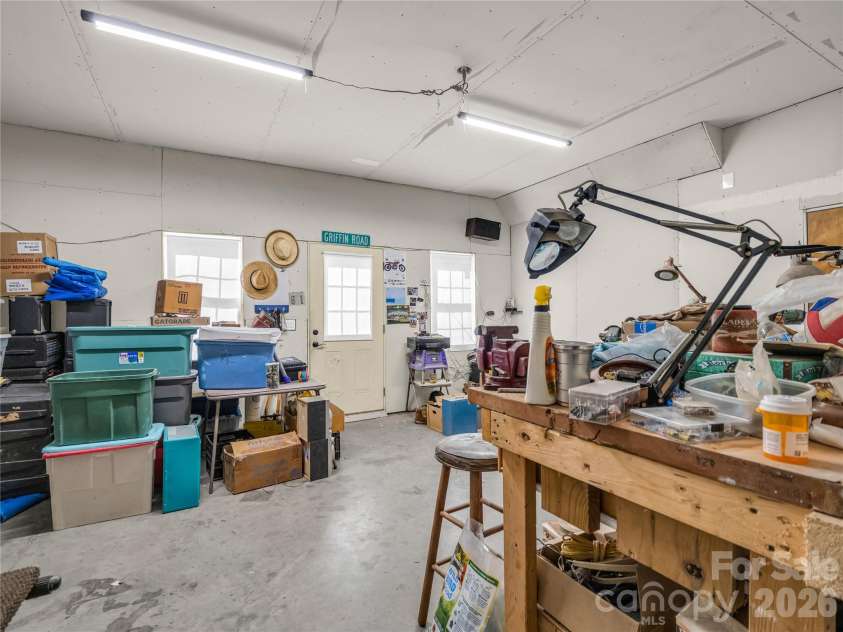 61 Mountain Shadows Drive, Leicester, NC 28748.  MLS# CAR4431319, YatesRealty ID 54790. Basement workshop