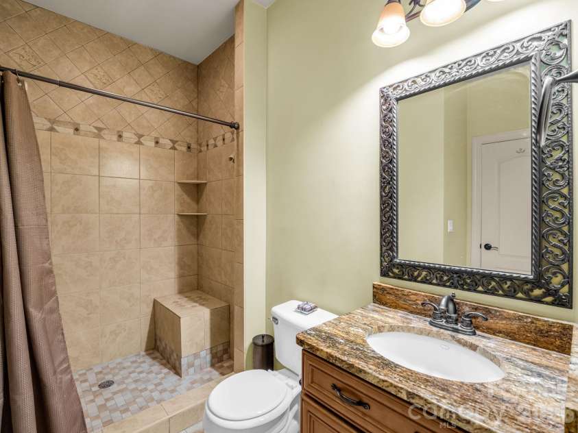 61 Mountain Shadows Drive, Leicester, NC 28748.  MLS# CAR4431319, YatesRealty ID 54790. En Suite guest bathroom to office