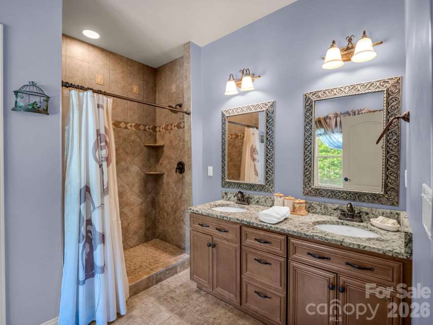 61 Mountain Shadows Drive, Leicester, NC 28748.  MLS# CAR4431319, YatesRealty ID 54790. Primary En Suite bathroom