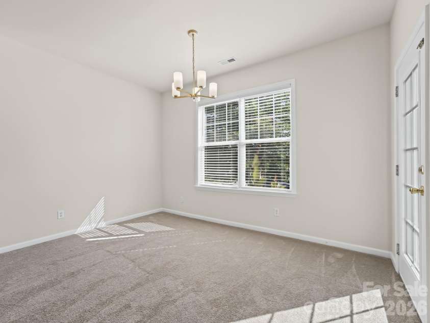 15 Chowan Drive, Fletcher, NC 28732.  MLS# CAR4430498, YatesRealty ID 54797. Dining area with new lighting
