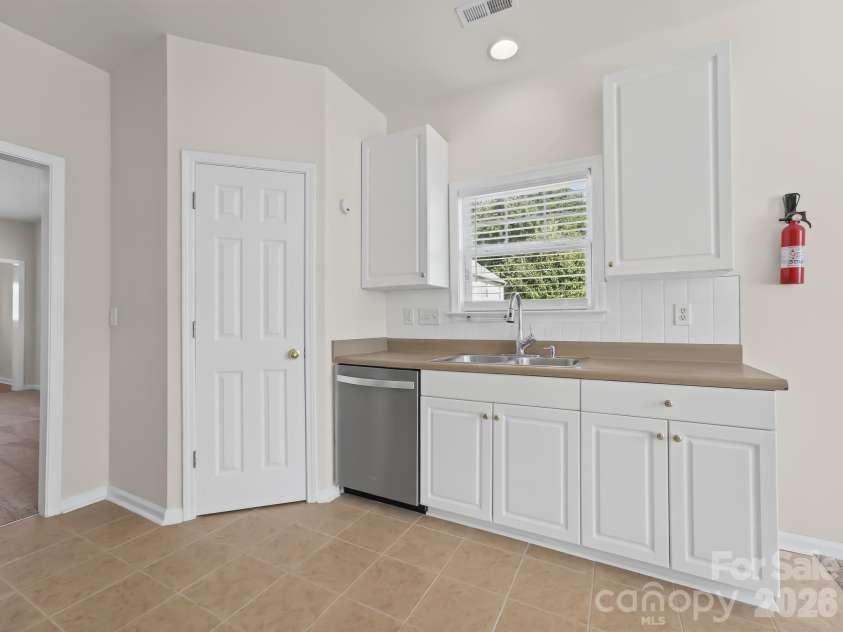 15 Chowan Drive, Fletcher, NC 28732.  MLS# CAR4430498, YatesRealty ID 54797. Large pantry has so many storage options