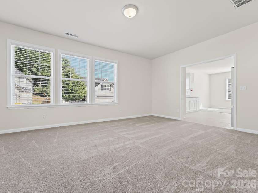 15 Chowan Drive, Fletcher, NC 28732.  MLS# CAR4430498, YatesRealty ID 54797. Living area is so bright and sunny