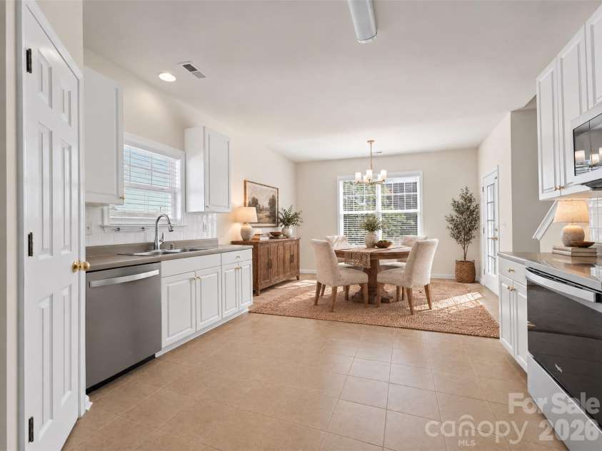 15 Chowan Drive, Fletcher, NC 28732.  MLS# CAR4430498, YatesRealty ID 54797. Virtually staged kitchen and dining area