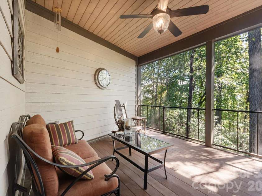 44 Sunset Trace, Brevard, NC 28712.  MLS# CAR4429326, YatesRealty ID 54809. Screened Porch overlooking water feature