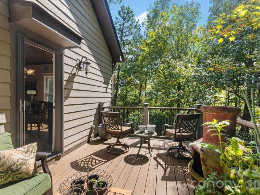 44 Sunset Trace, Brevard, NC 28712.  MLS# CAR4429326, YatesRealty ID 54809. Side Deck Nestled in the Trees
