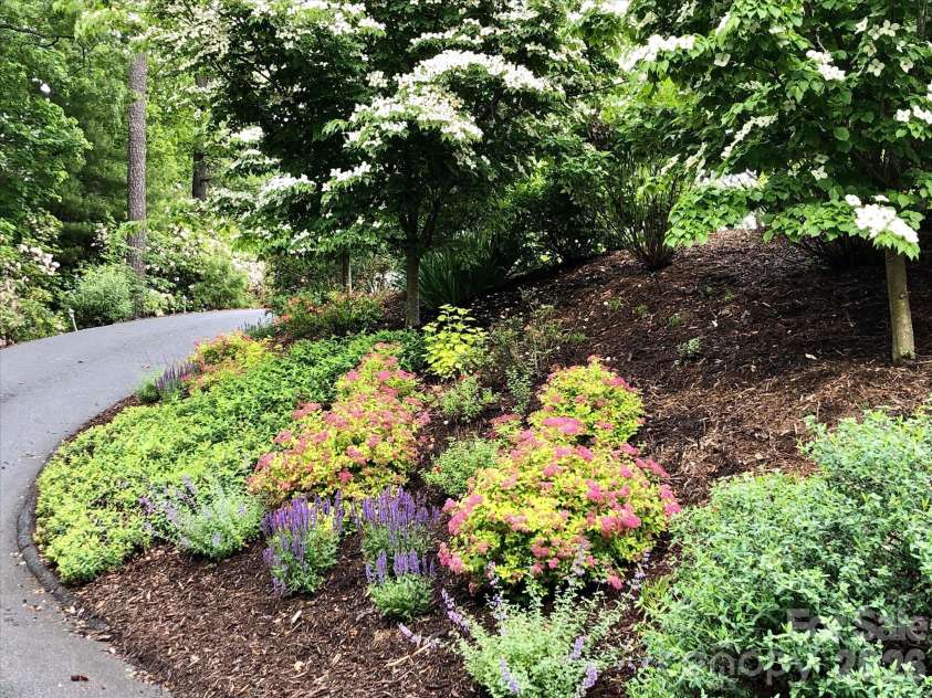 44 Sunset Trace, Brevard, NC 28712.  MLS# CAR4429326, YatesRealty ID 54809. Spectacular landscaping!