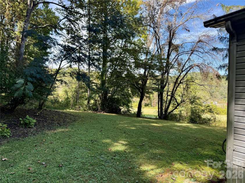 878 GW G W Whitmire Road, Rosman, NC 28772.  MLS# CAR4427358, YatesRealty ID 54831. Side Yard