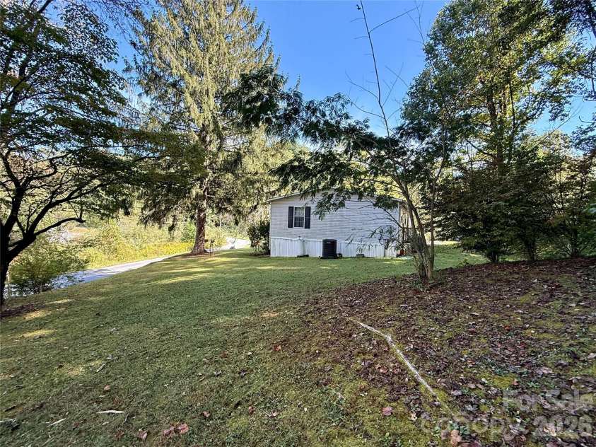 878 GW G W Whitmire Road, Rosman, NC 28772.  MLS# CAR4427358, YatesRealty ID 54831. Side Yard