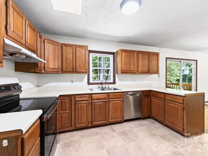 340 Genesis Circle, Black Mountain, NC 28711.  MLS# CAR4429667, YatesRealty ID 54851. Kitchen with View of Back Yard