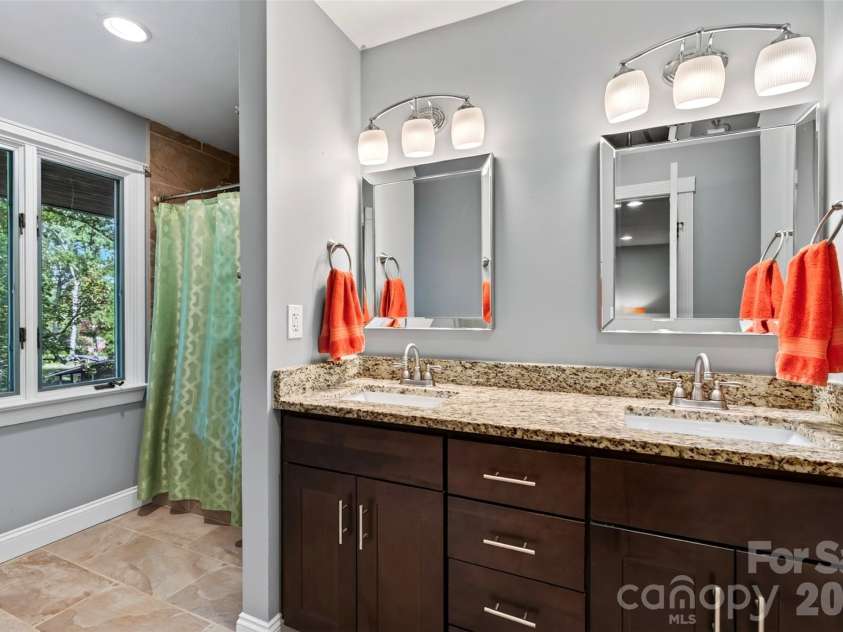 14 Willow Road, Asheville, NC 28804.  MLS# CAR4429269, YatesRealty ID 54853. Primary bath with dual sinks.